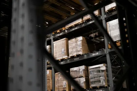 Cases of gloves packed for a shop order
