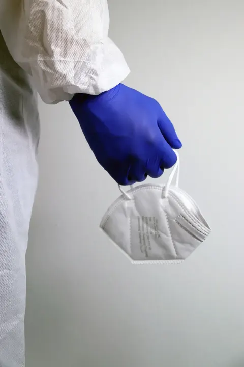 Close-up of black nitrile examination gloves